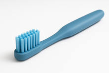 Load image into Gallery viewer, A blue tooth brush